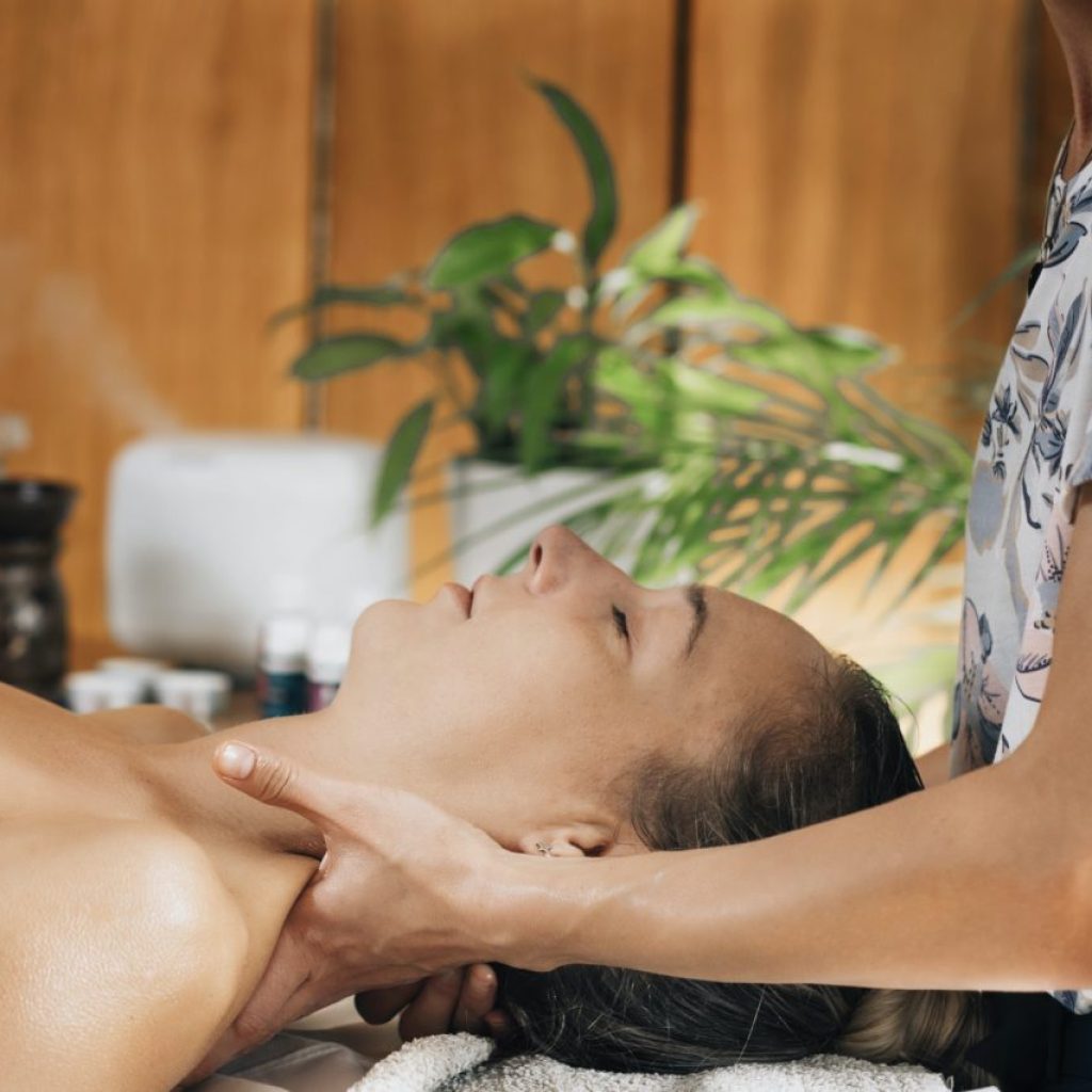 aromatherapy-massage-masseuse-massaging-client-with-therapeutic-ethereal-oil.jpg